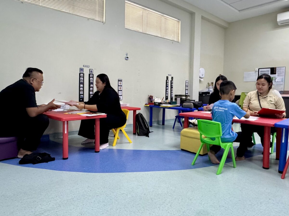 Malaysian researchers interviewing chldren in a school
