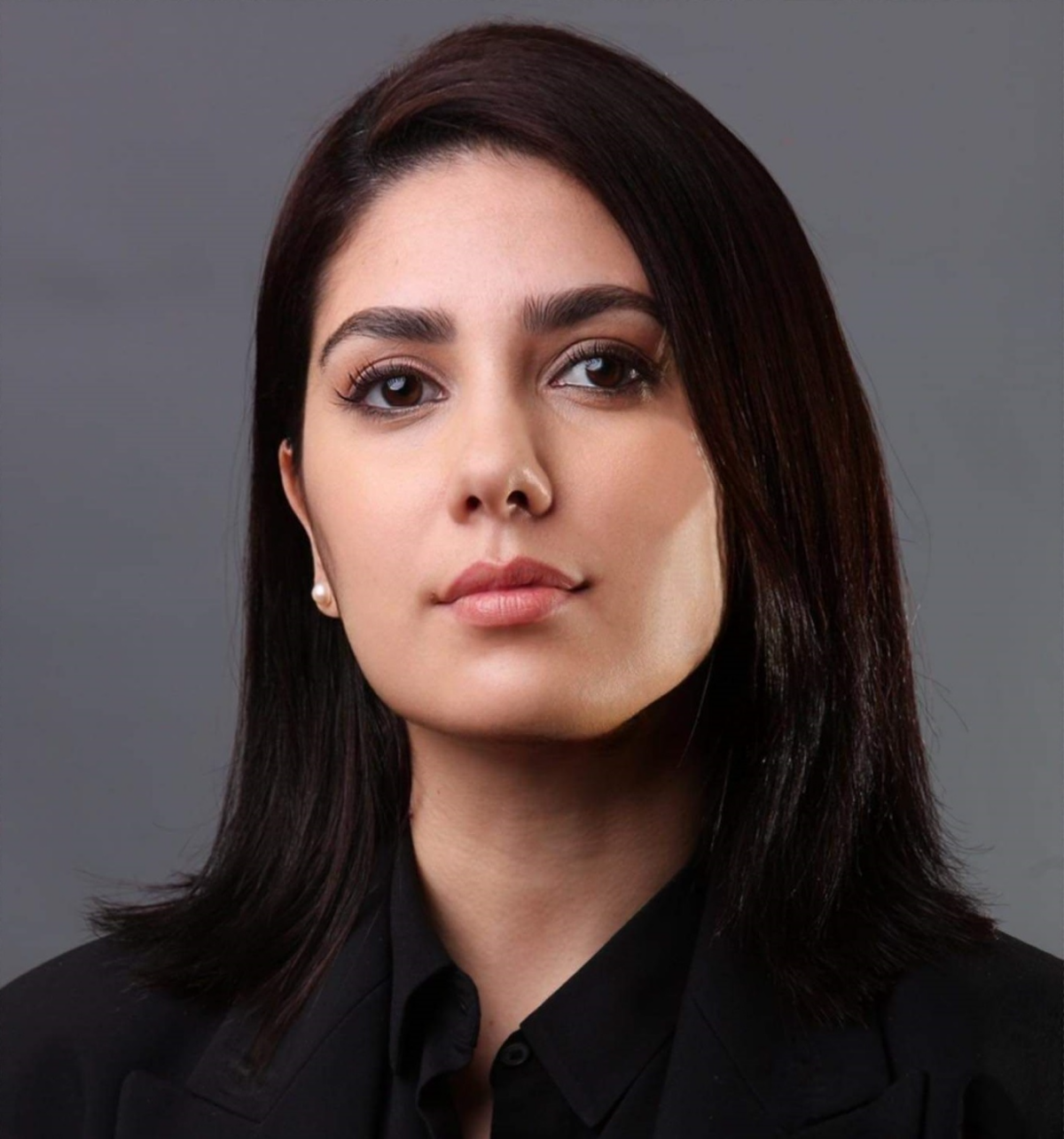 Lamayae Khomsi, woman with shoulder-length black hair and a black shirt