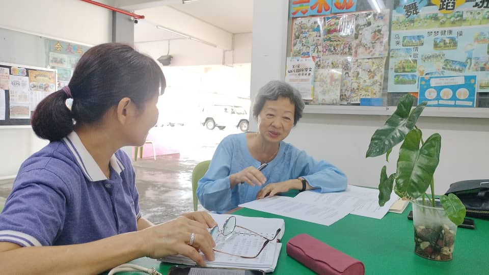 Researchers discuss project objectives at a table